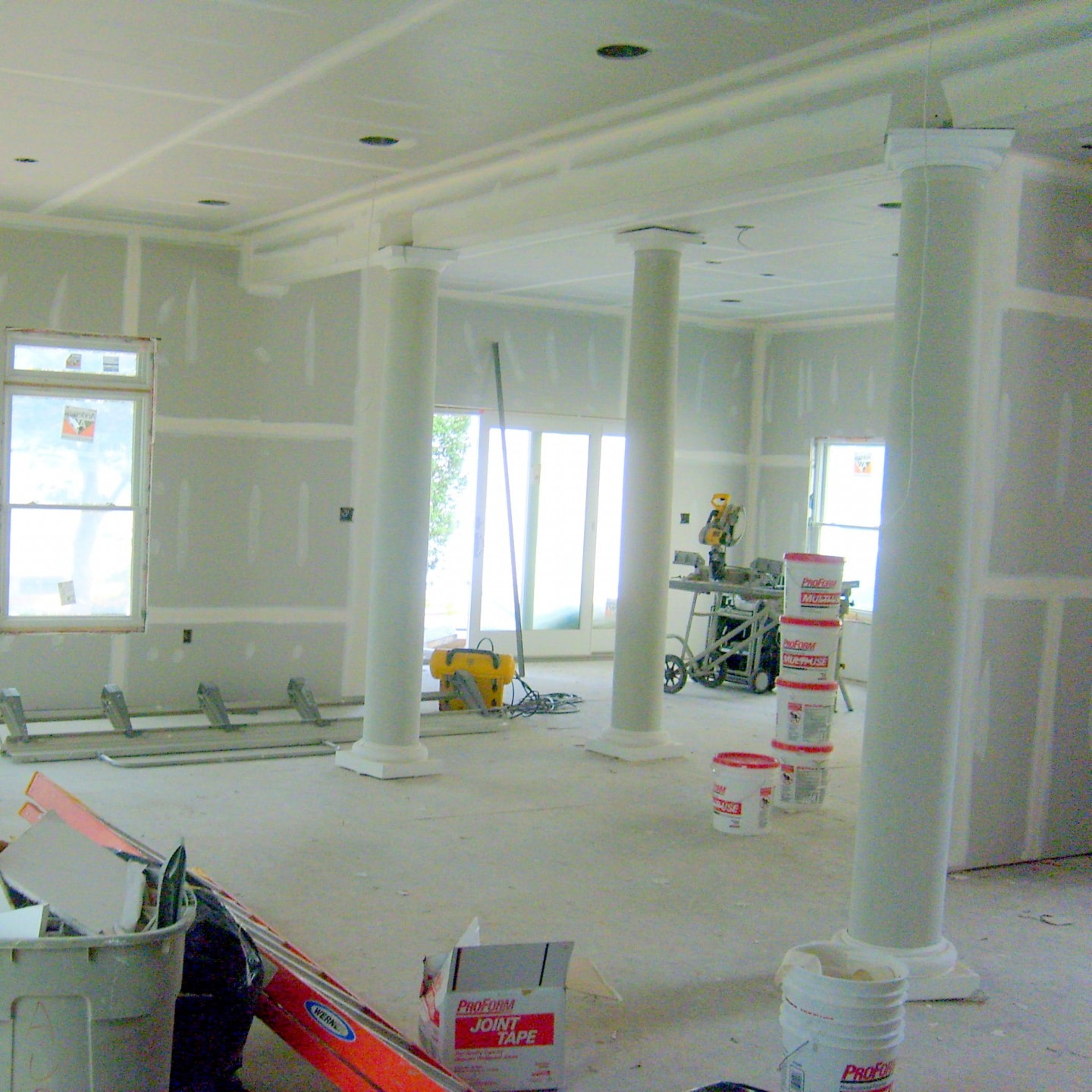 Large commercial space drywall installation with columns